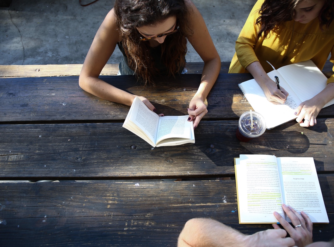 Banner image of three people sitting together